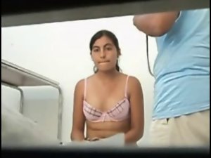 Handsome girl showing her knockers to physician